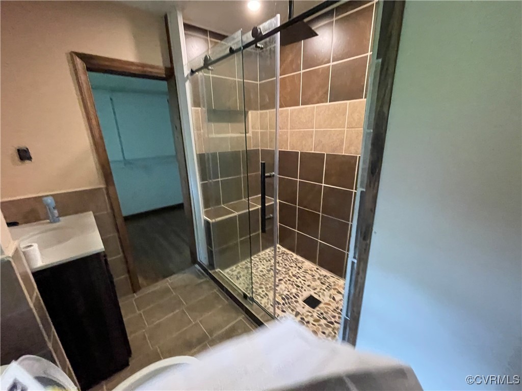 2806 Trarich Road Petersburg, VA 23805 - Photo 6 of 14 Bathroom with tile patterned floors, an enclosed s