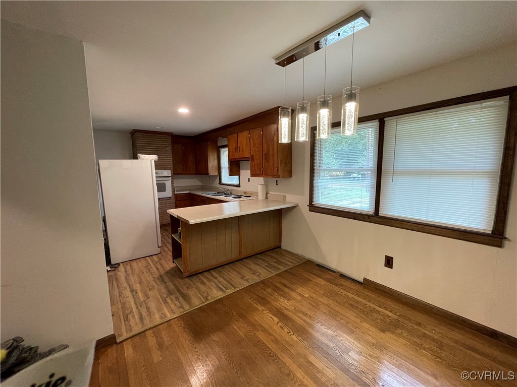 2806 Trarich Road Petersburg, VA 23805 - Photo 10 of 14 Kitchen with white appliances, kitchen peninsula,