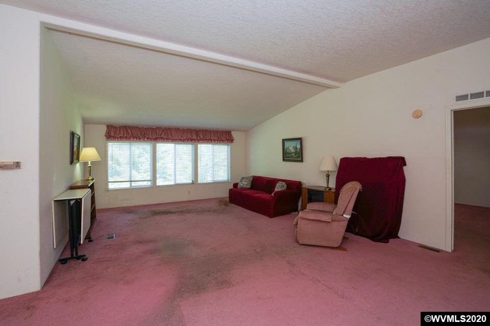 17265 Butler Hill Road Dallas, OR 97338 - Photo 16 of 38 a living room with furniture and a window