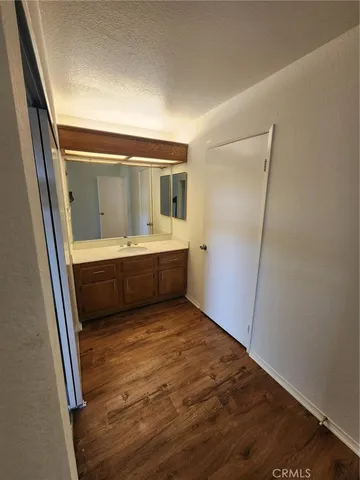 a view of bathroom with sink and mirror