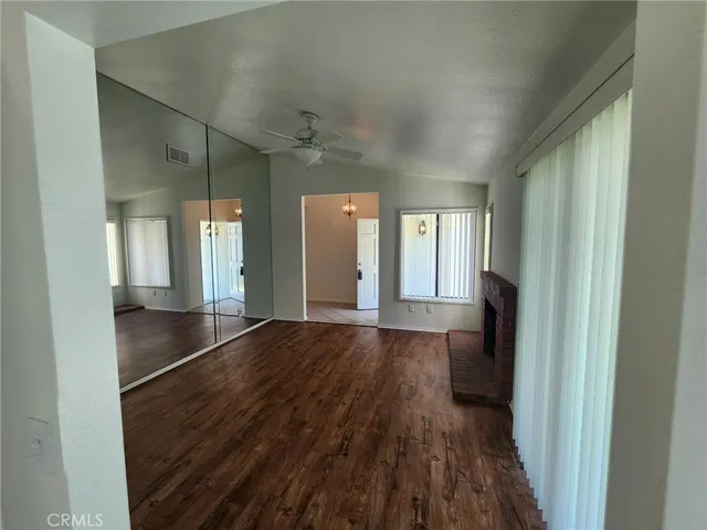 a view of gallery with wooden floor