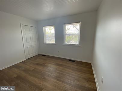 611 Anvil Road Fredericksburg, VA 22405 - Photo 12 of 29 an empty room with wooden floor and windows
