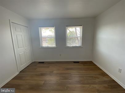 611 Anvil Road Fredericksburg, VA 22405 - Photo 13 of 29 an empty room with wooden floor and windows