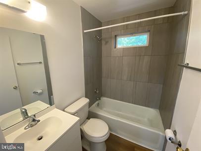 611 Anvil Road Fredericksburg, VA 22405 - Photo 15 of 29 a bathroom with a sink mirror vanity and toilet