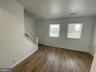 611 Anvil Road Fredericksburg, VA 22405 - Photo 2 of 29 an empty room with wooden floor and windows