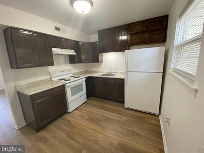 611 Anvil Road Fredericksburg, VA 22405 - Photo 8 of 29 a kitchen with stainless steel appliances granite countertop a stove a sink and a refrigerator