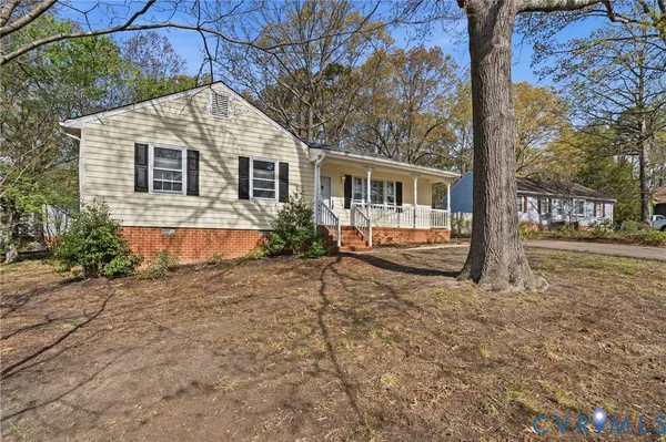 a view of a house with a snow in the yard