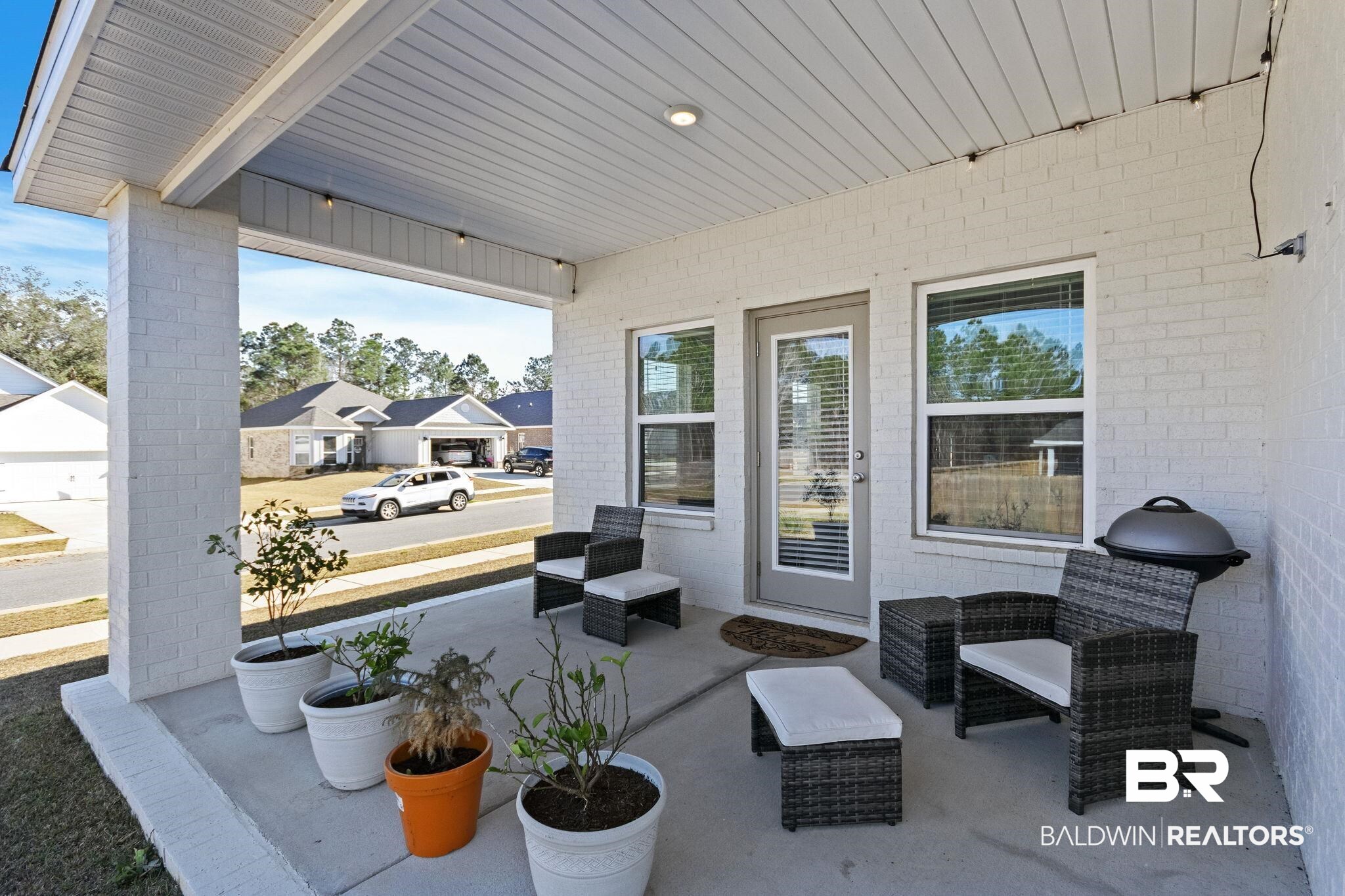 12919 Torrent Road Fairhope, AL 36532 - Photo 50 of 74 Covered porch featuring a residential view