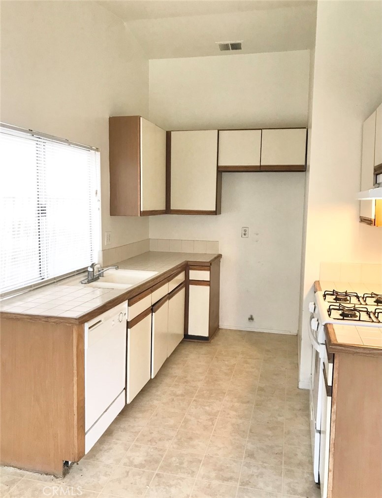 150 Elmtree Drive Perris, CA 92571 - Photo 5 of 10 a bathroom with a sink and a mirror