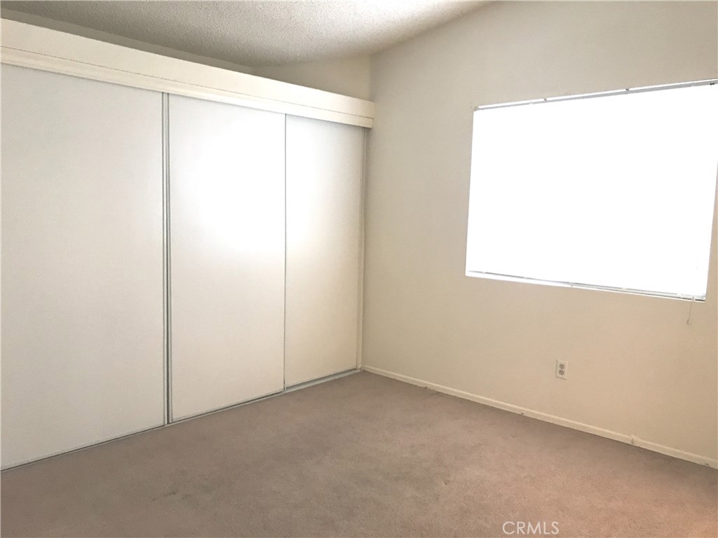 150 Elmtree Drive Perris, CA 92571 - Photo 7 of 10 a view of a room that has a window in it