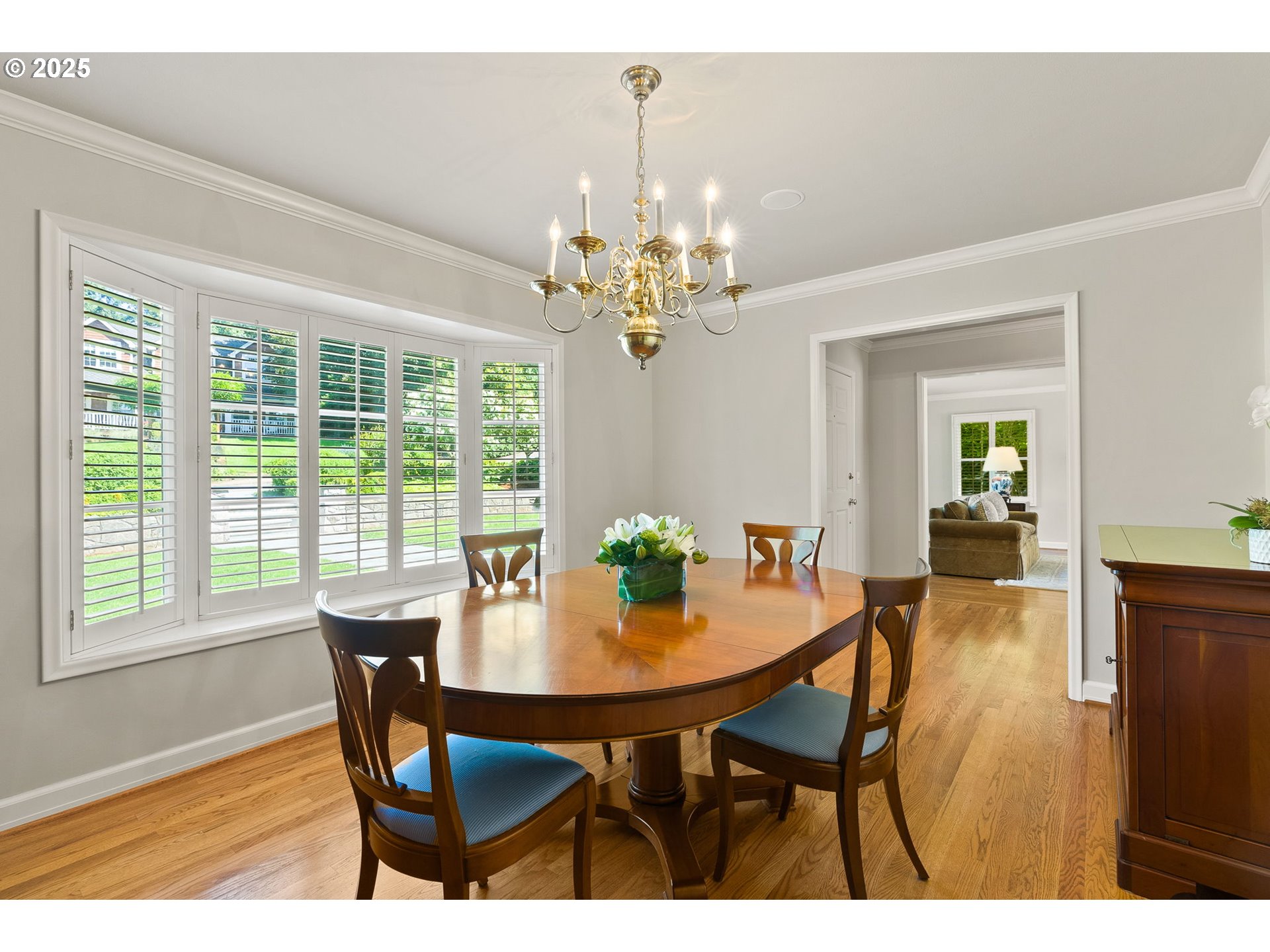 2100 Hillside Drive Lake Oswego, OR 97034 - Photo 11 of 40 a dining room with furniture a chandelier and wooden floor
