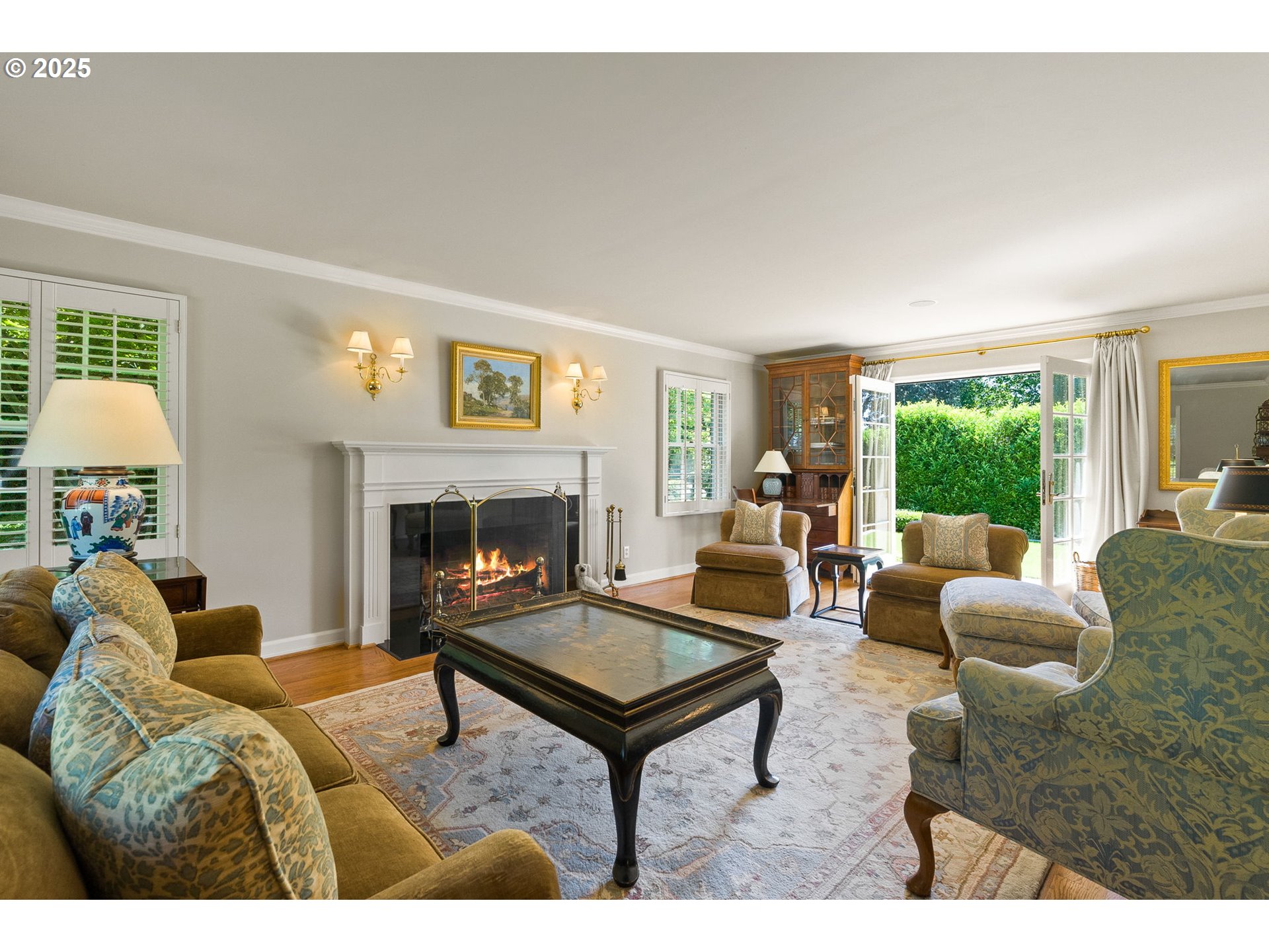 2100 Hillside Drive Lake Oswego, OR 97034 - Photo 12 of 40 a living room with furniture a rug and a fireplace