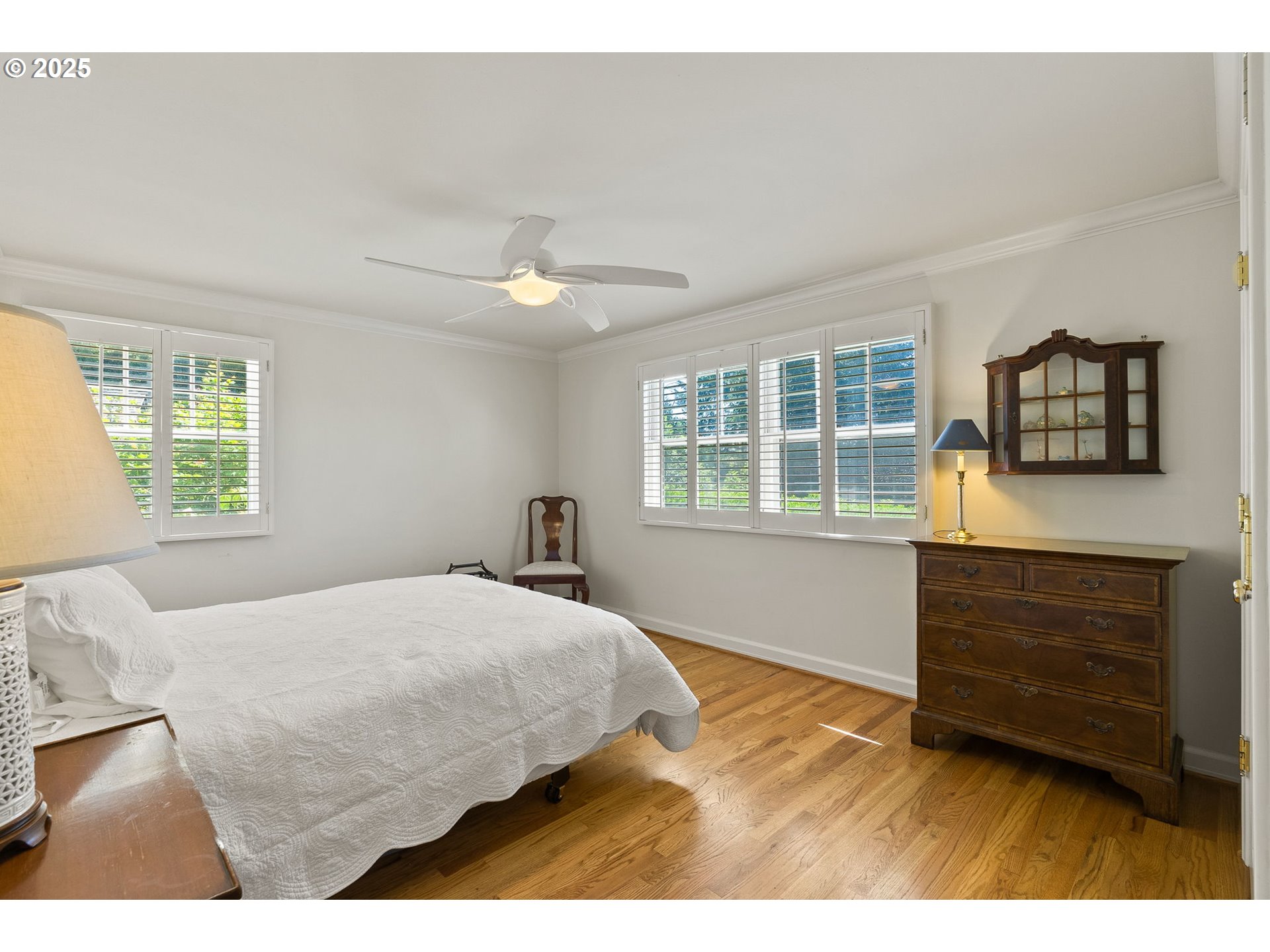 2100 Hillside Drive Lake Oswego, OR 97034 - Photo 26 of 40 a bedroom with a bed and a flat tv screen
