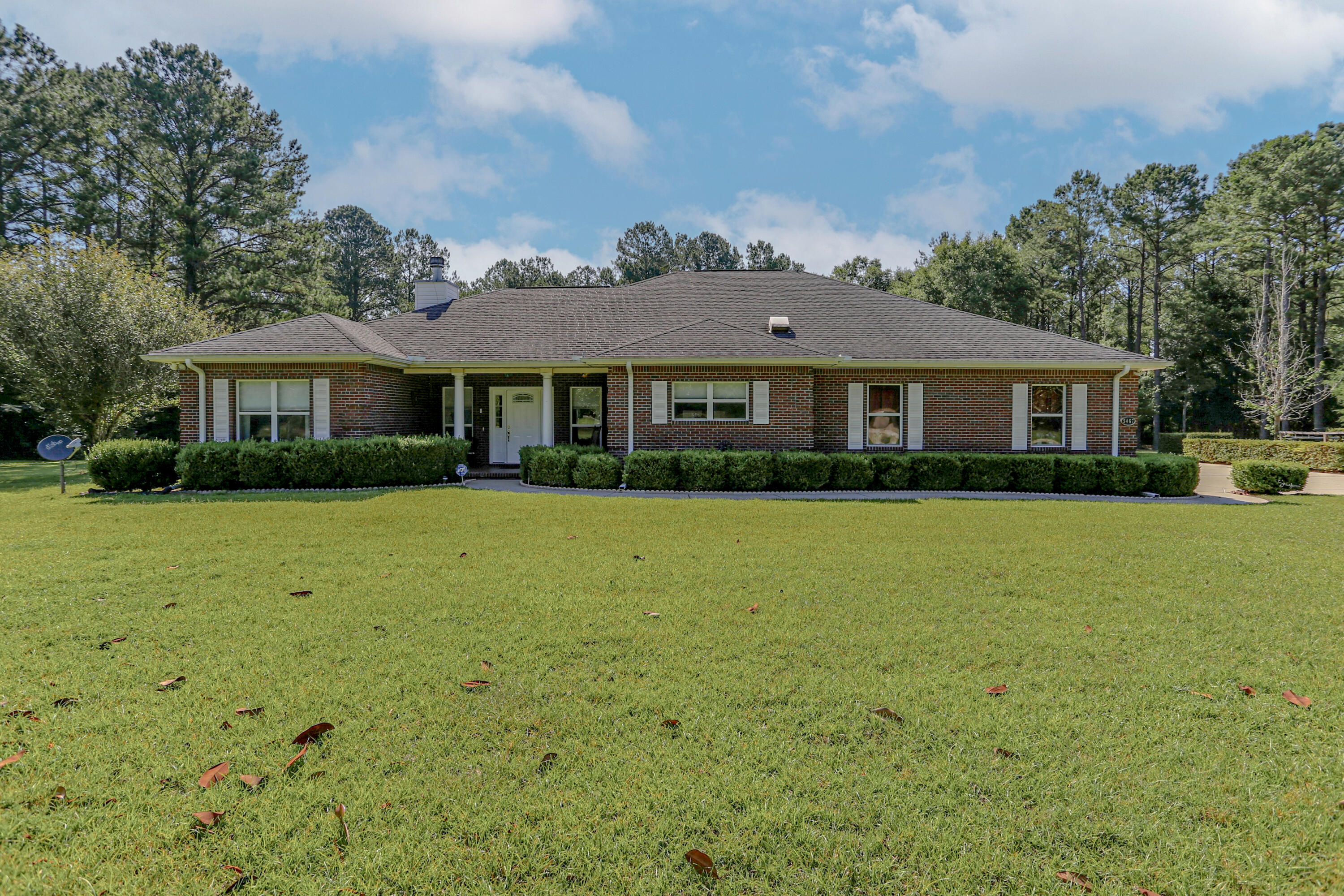 a front view of a house with a yard