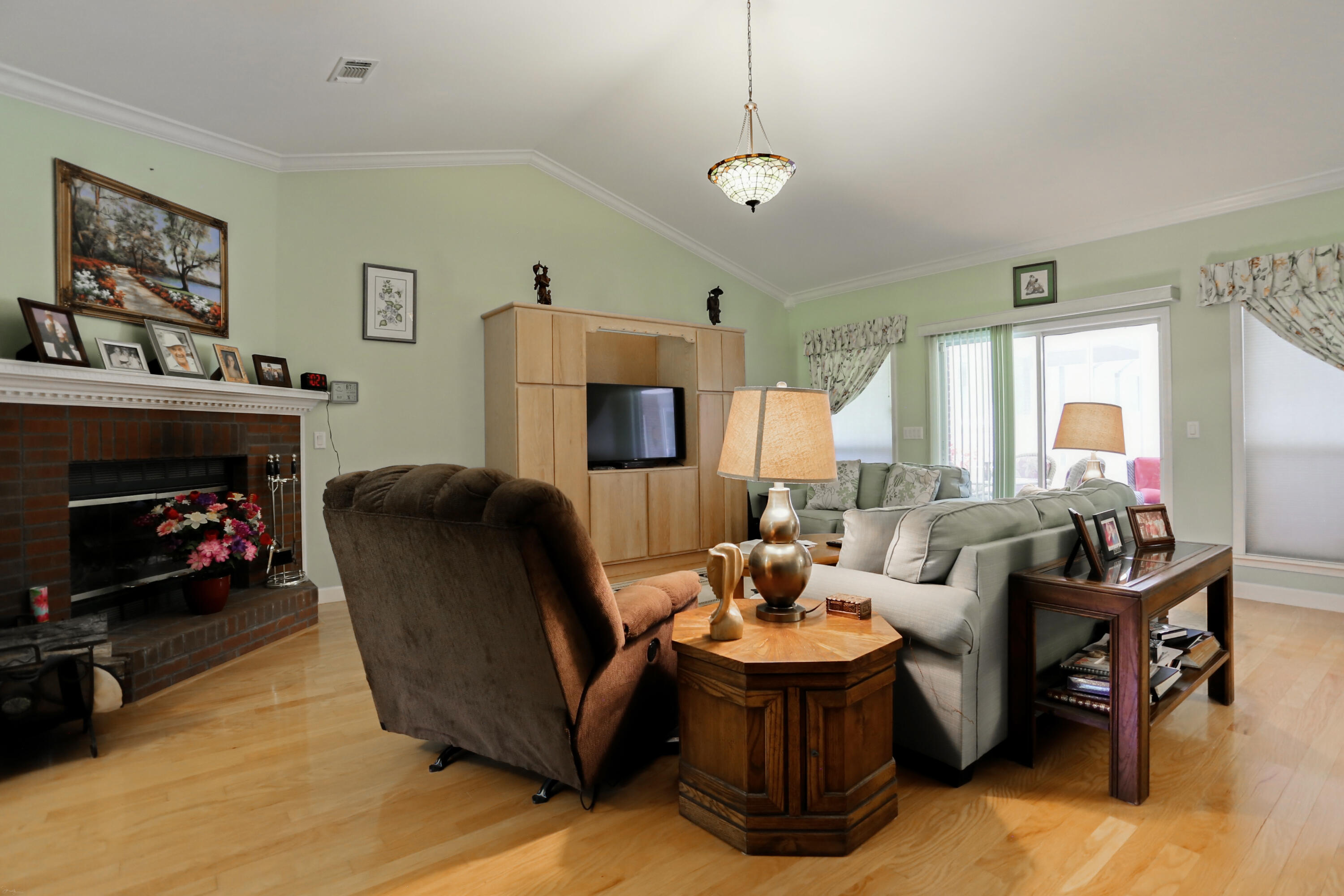 5467 Old River Road Baker, FL 32531 - Photo 20 of 55 a living room with furniture fireplace and a large window