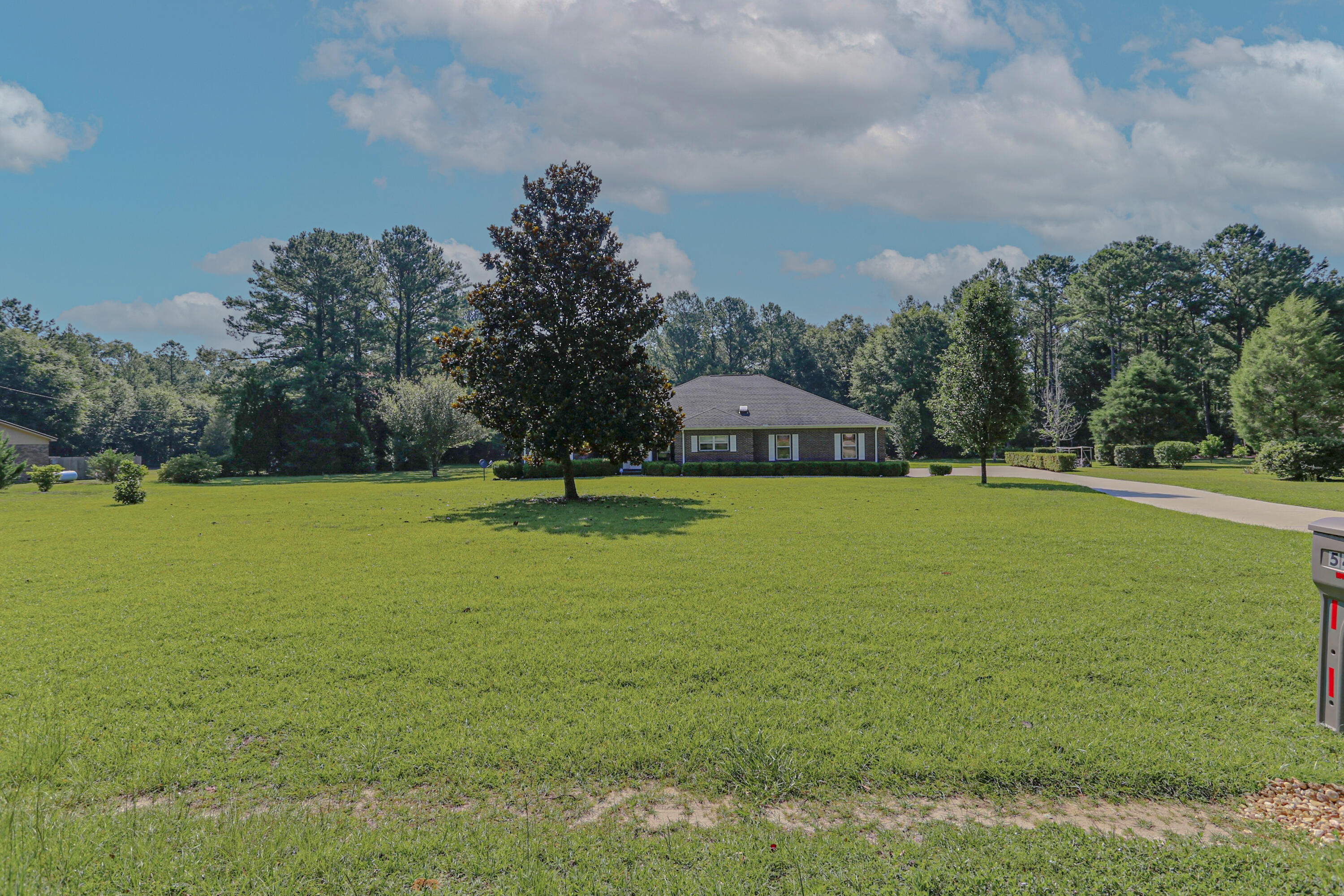 5467 Old River Road Baker, FL 32531 - Photo 2 of 55 a view of a lake with houses in the background