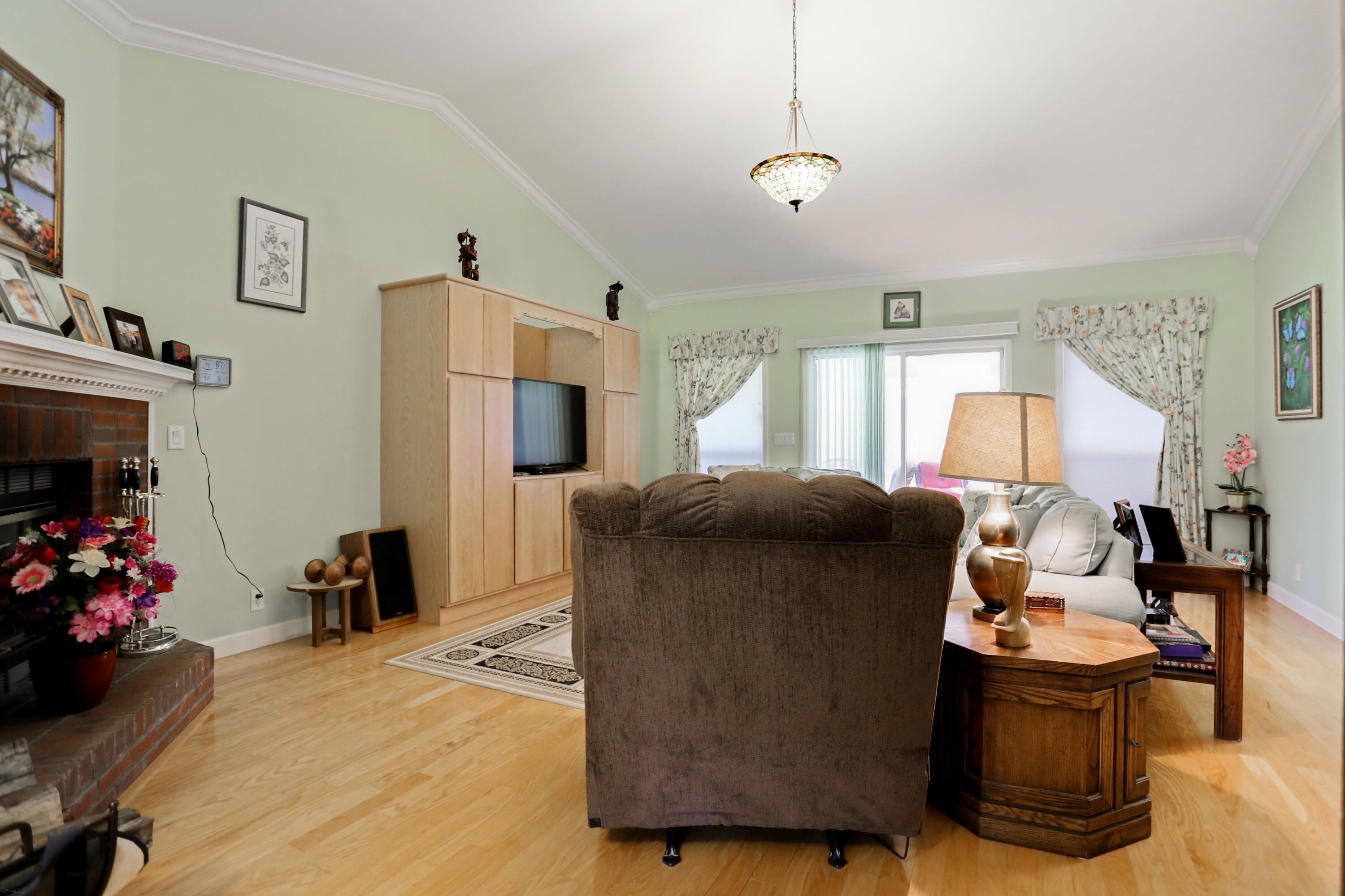 5467 Old River Road Baker, FL 32531 - Photo 21 of 55 a living room with furniture and a flat screen tv