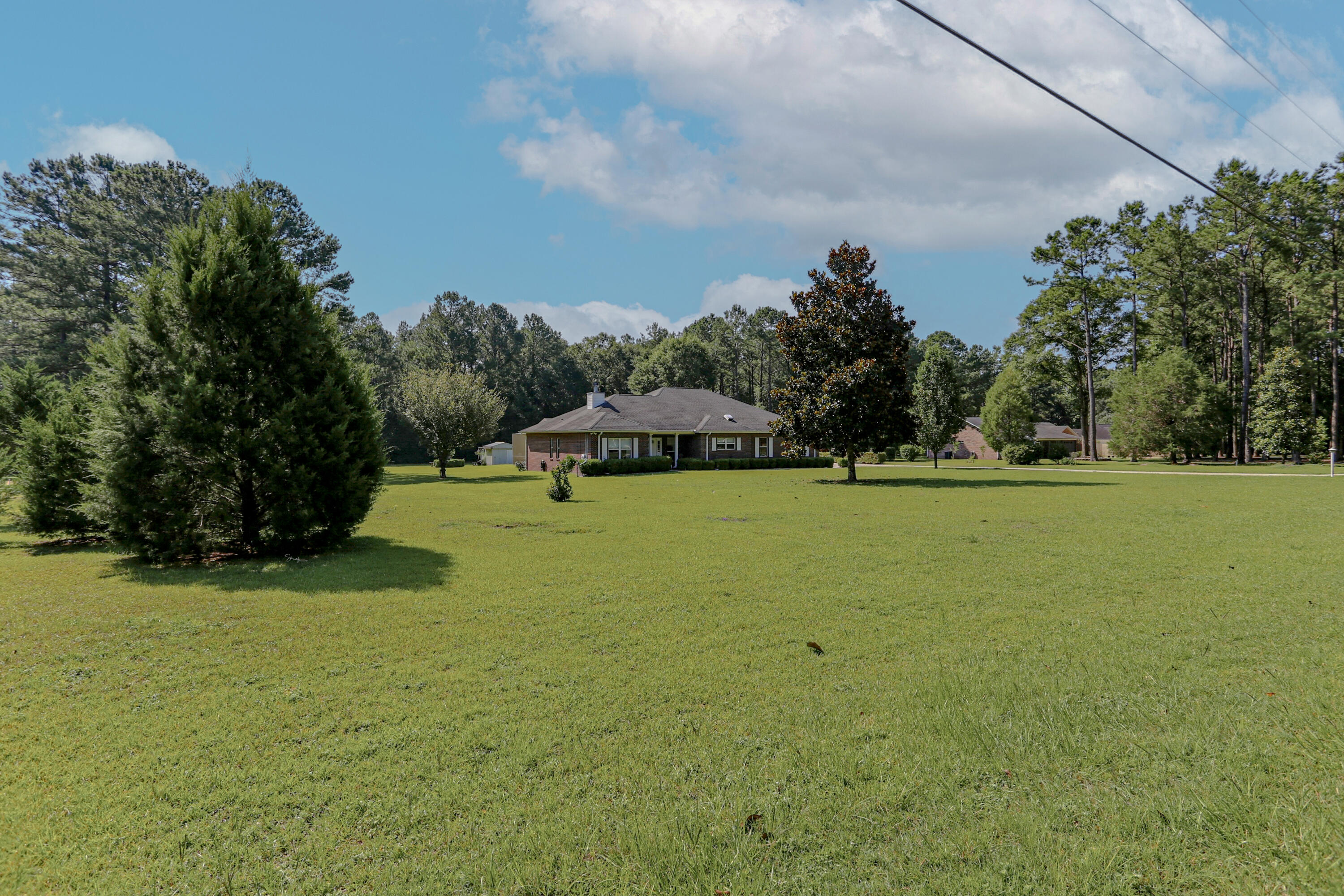 5467 Old River Road Baker, FL 32531 - Photo 3 of 55 a view of a golf course with a park
