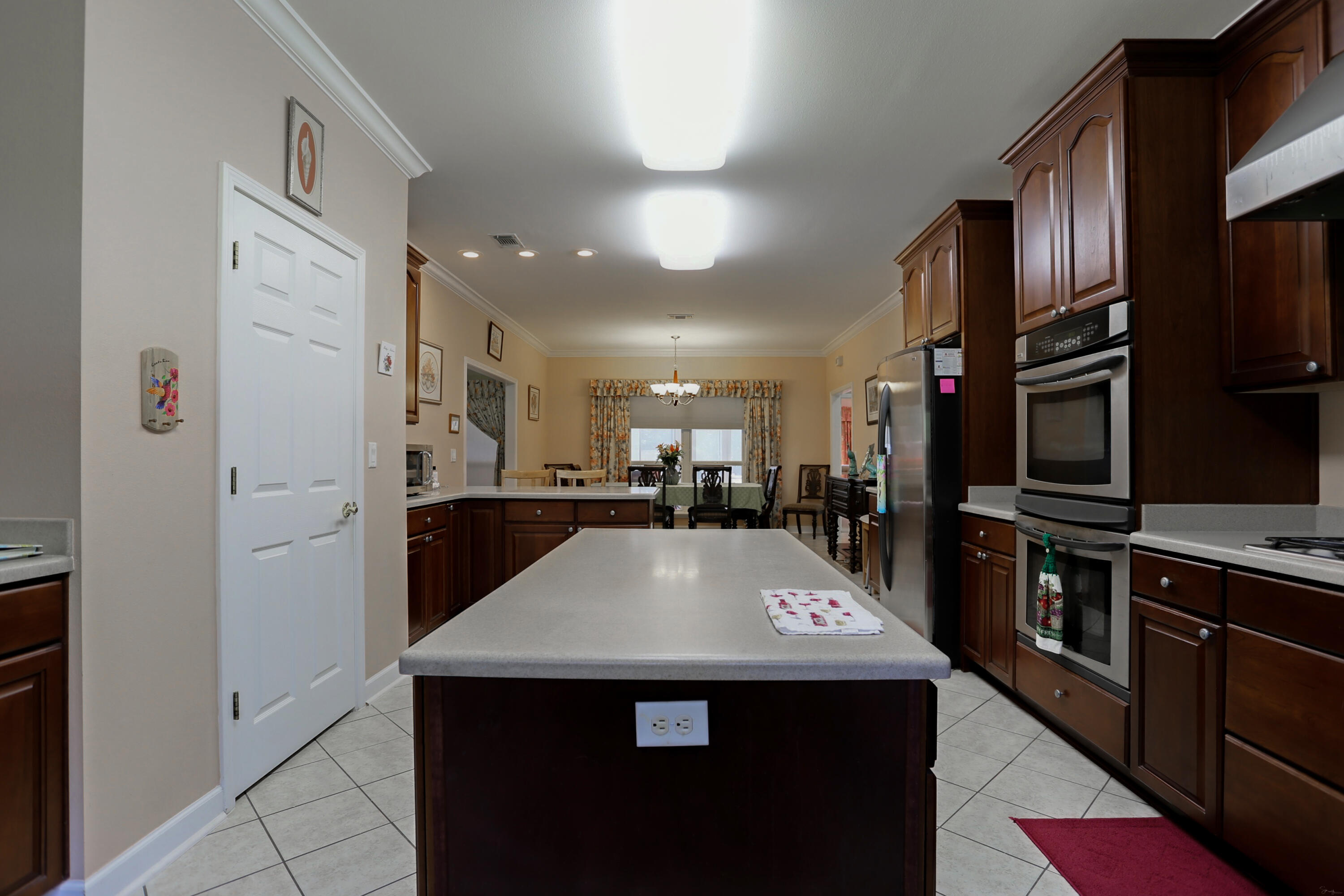 5467 Old River Road Baker, FL 32531 - Photo 31 of 55 a kitchen with stainless steel appliances granite countertop a refrigerator a sink dishwasher a stove and a refrigerator with wooden floor