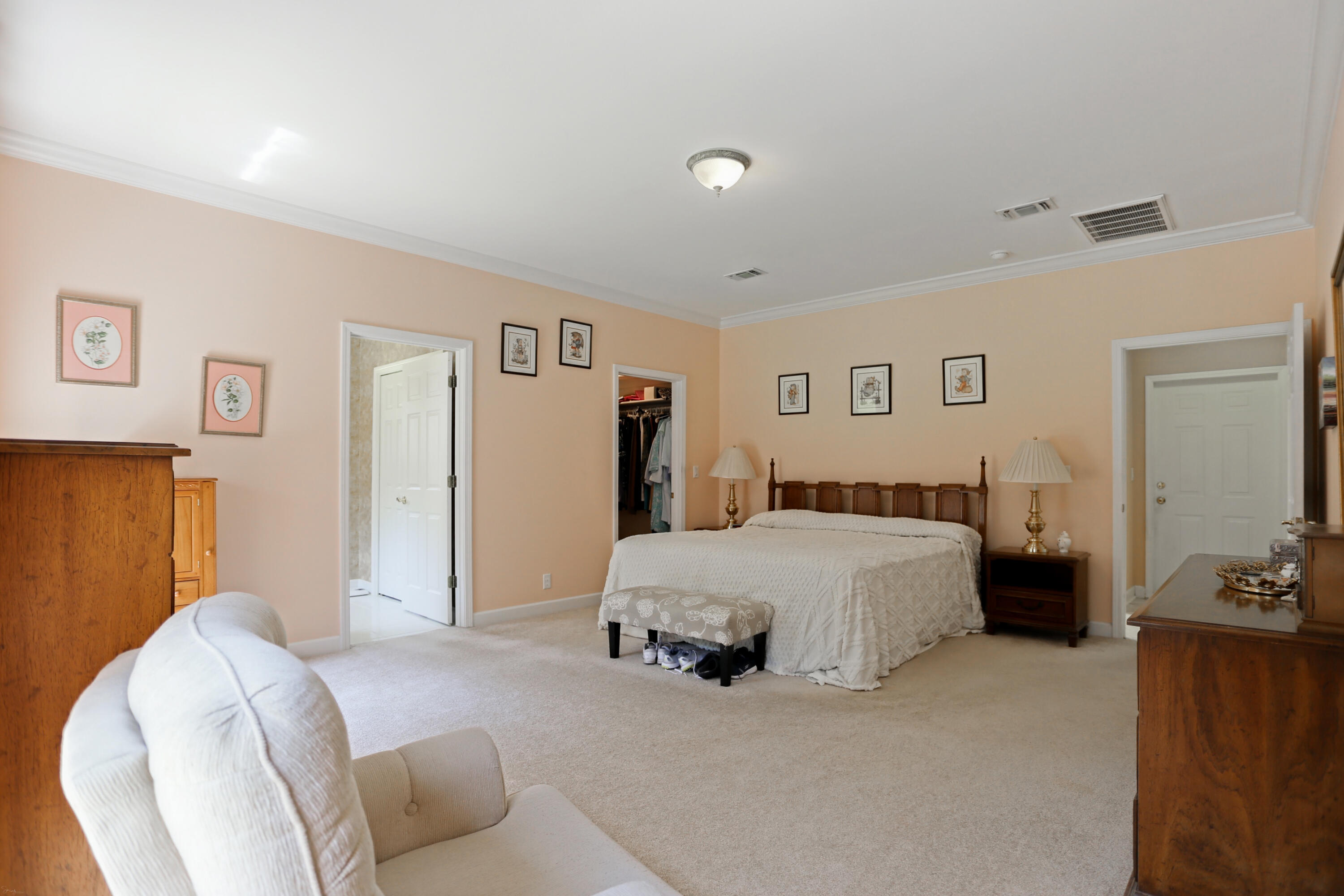 5467 Old River Road Baker, FL 32531 - Photo 35 of 55 a spacious bedroom with a bed and a couch