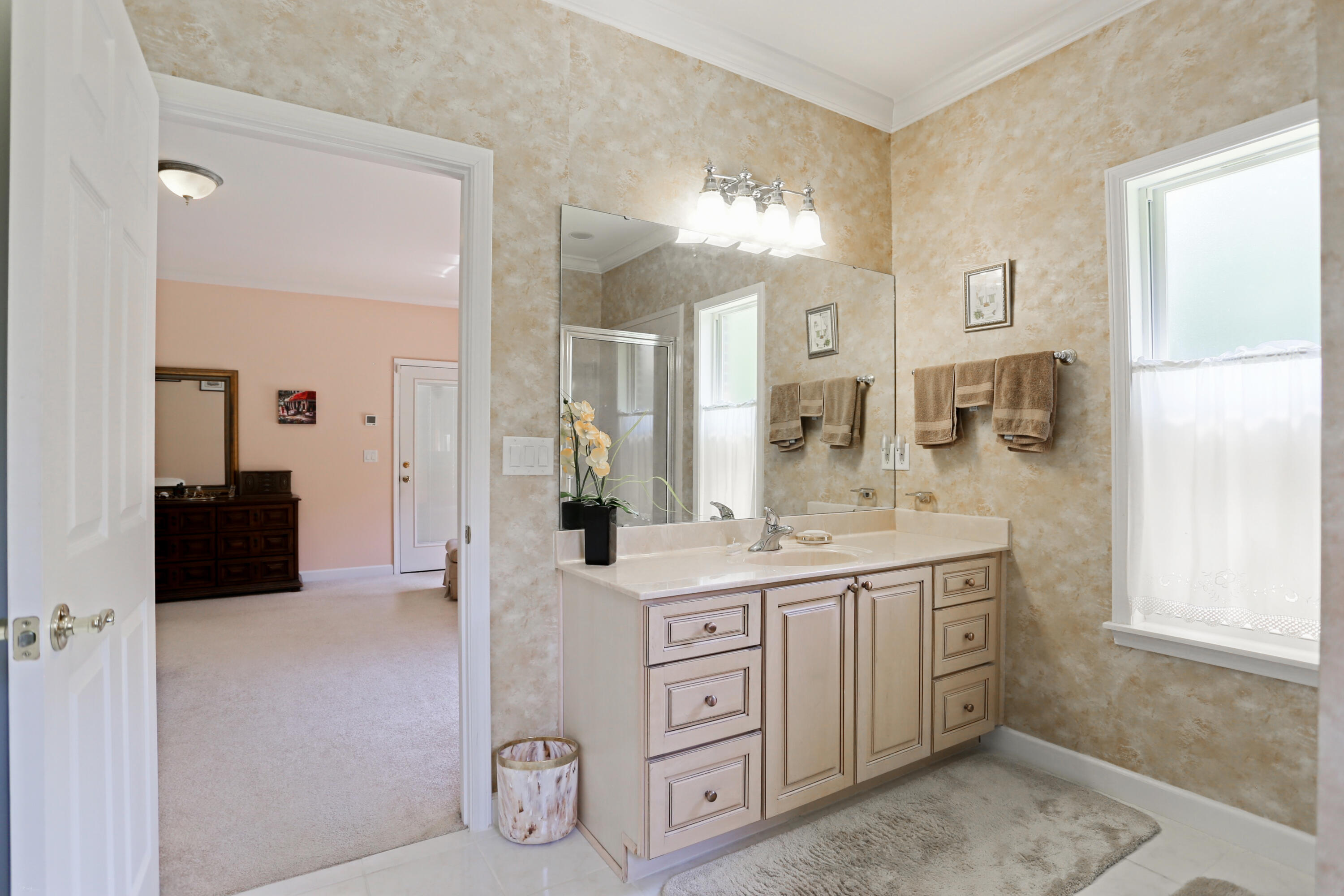 5467 Old River Road Baker, FL 32531 - Photo 38 of 55 a spacious bathroom with a granite countertop sink and a mirror