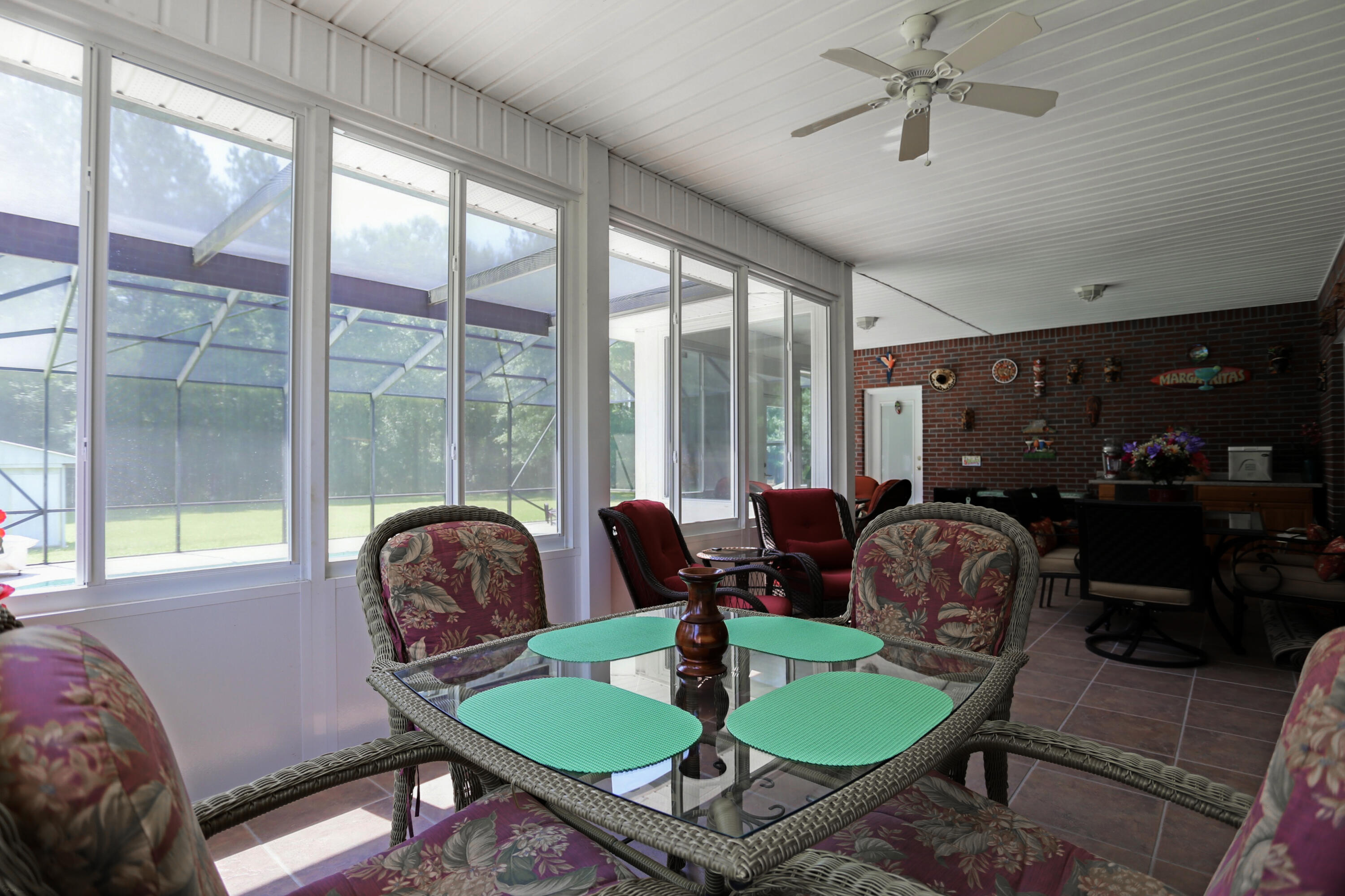 5467 Old River Road Baker, FL 32531 - Photo 41 of 55 a living room with furniture and a floor to ceiling window
