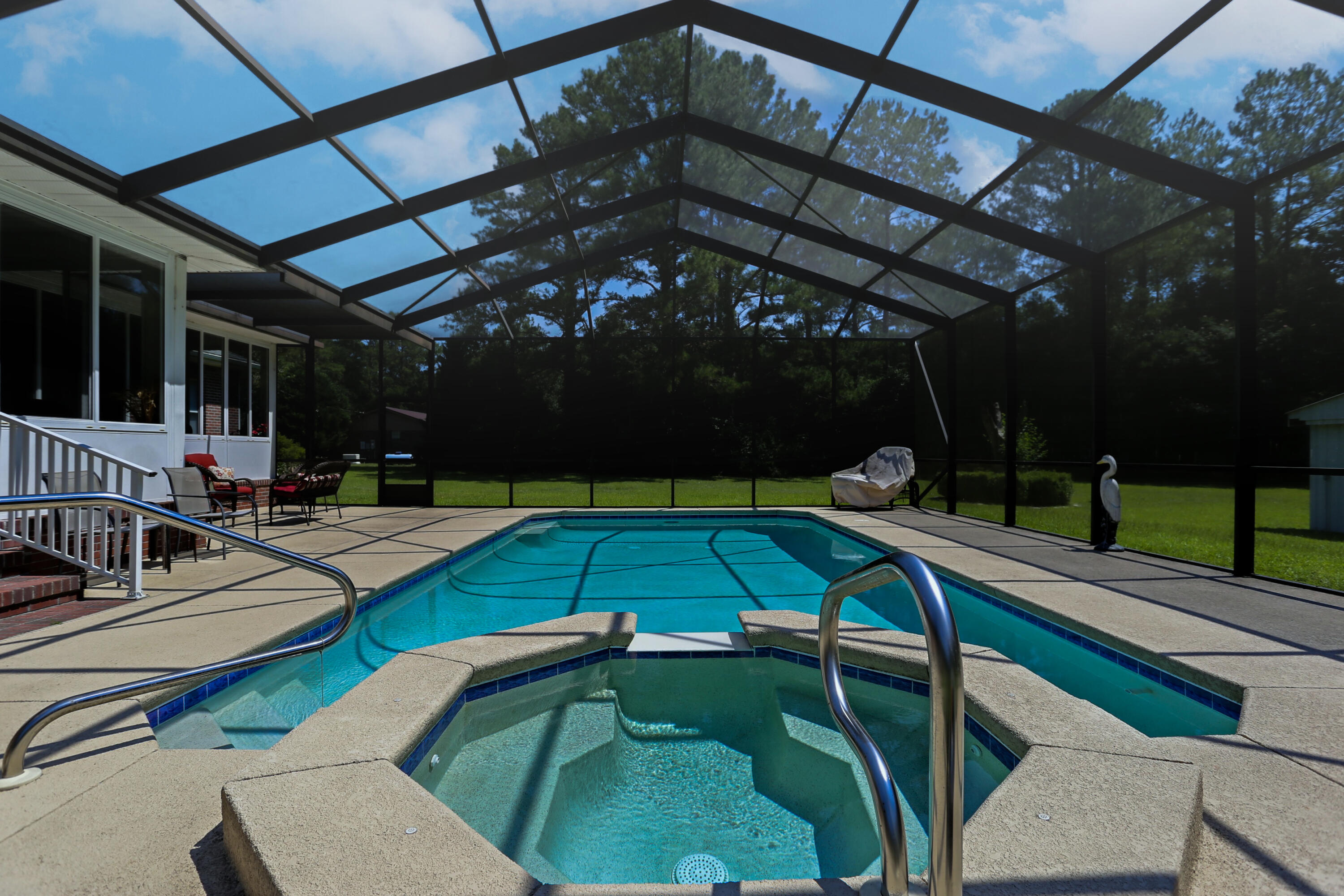 5467 Old River Road Baker, FL 32531 - Photo 45 of 55 a view of a swimming pool with a patio