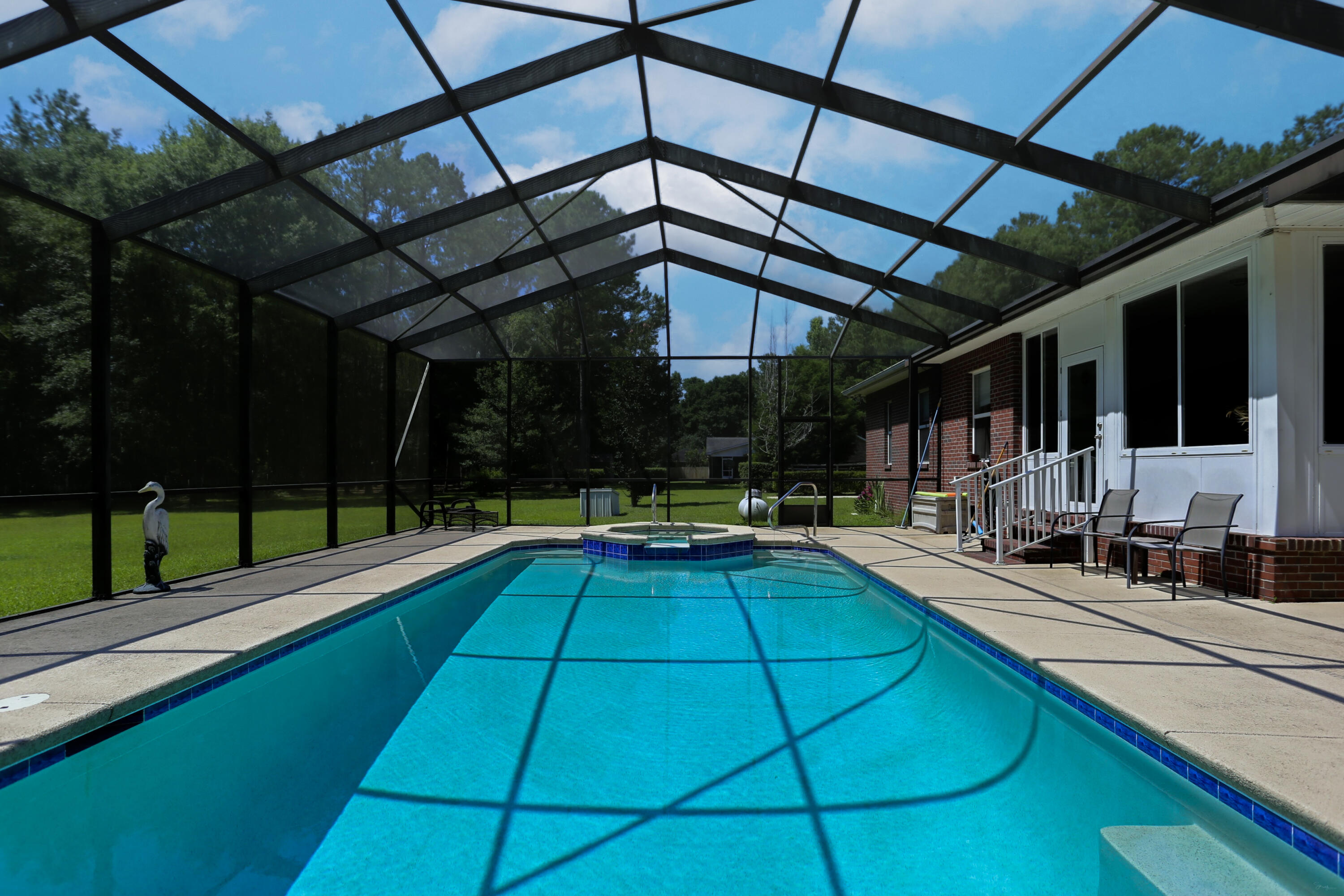 5467 Old River Road Baker, FL 32531 - Photo 48 of 55 a view of a backyard with swimming pool