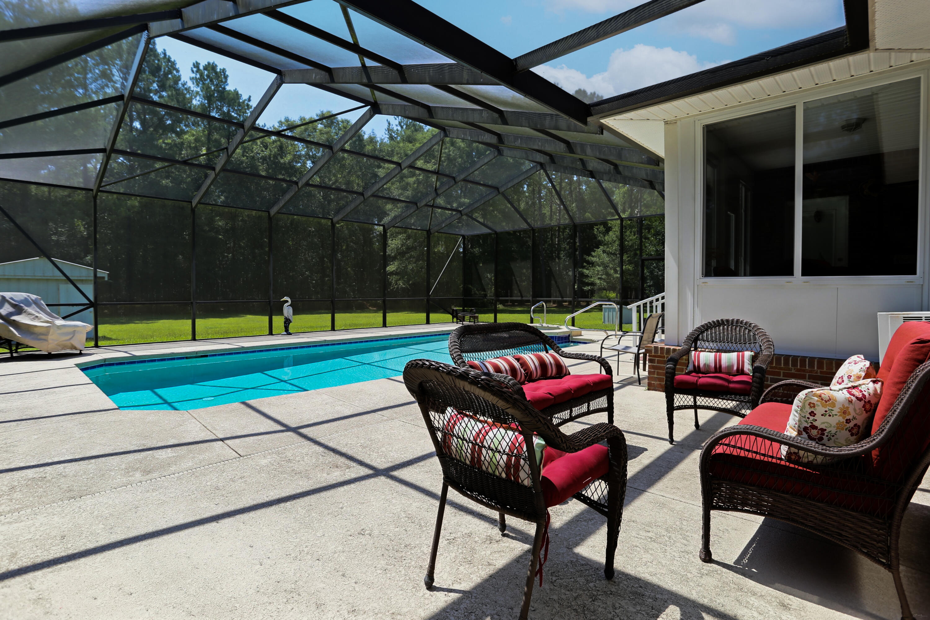 5467 Old River Road Baker, FL 32531 - Photo 49 of 55 a backyard with a table and chairs