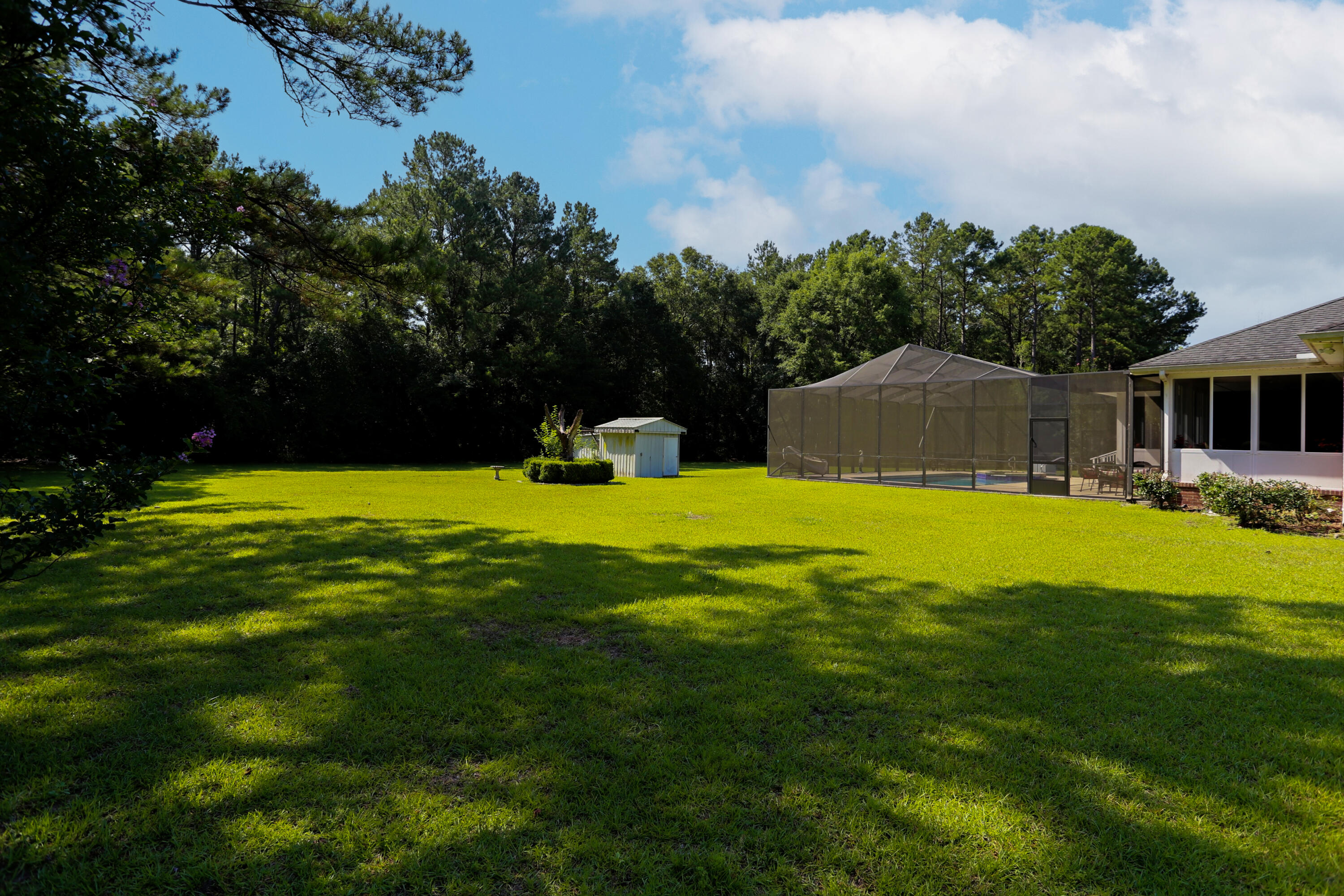 5467 Old River Road Baker, FL 32531 - Photo 55 of 55 a swimming pool with outdoor seating and yard