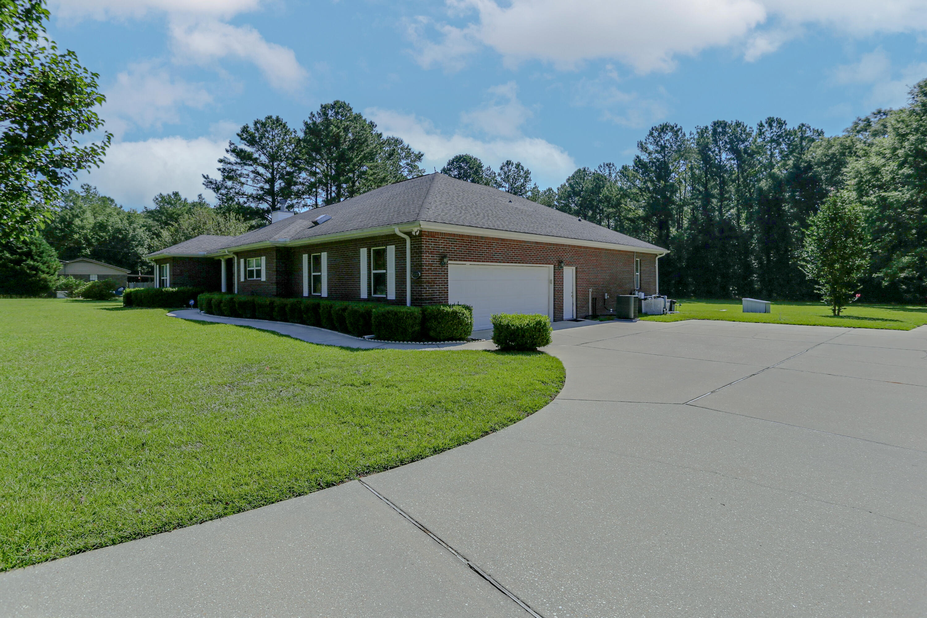 5467 Old River Road Baker, FL 32531 - Photo 7 of 55 a front view of a house with garden
