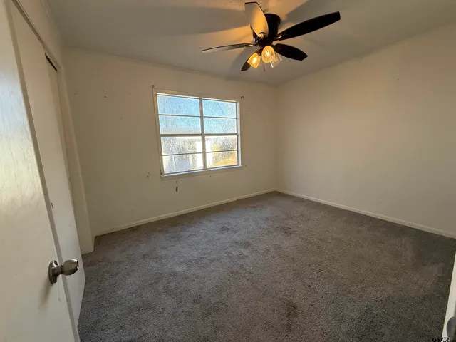 a kitchen with a refrigerator and a sink