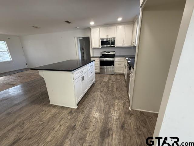 207 South Sun Camp Road White Oak, TX 75693 - Photo 4 of 18 a kitchen with stainless steel appliances a refrigerator and a stove top oven