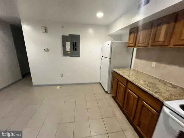 a view of a kitchen with storage and utility
