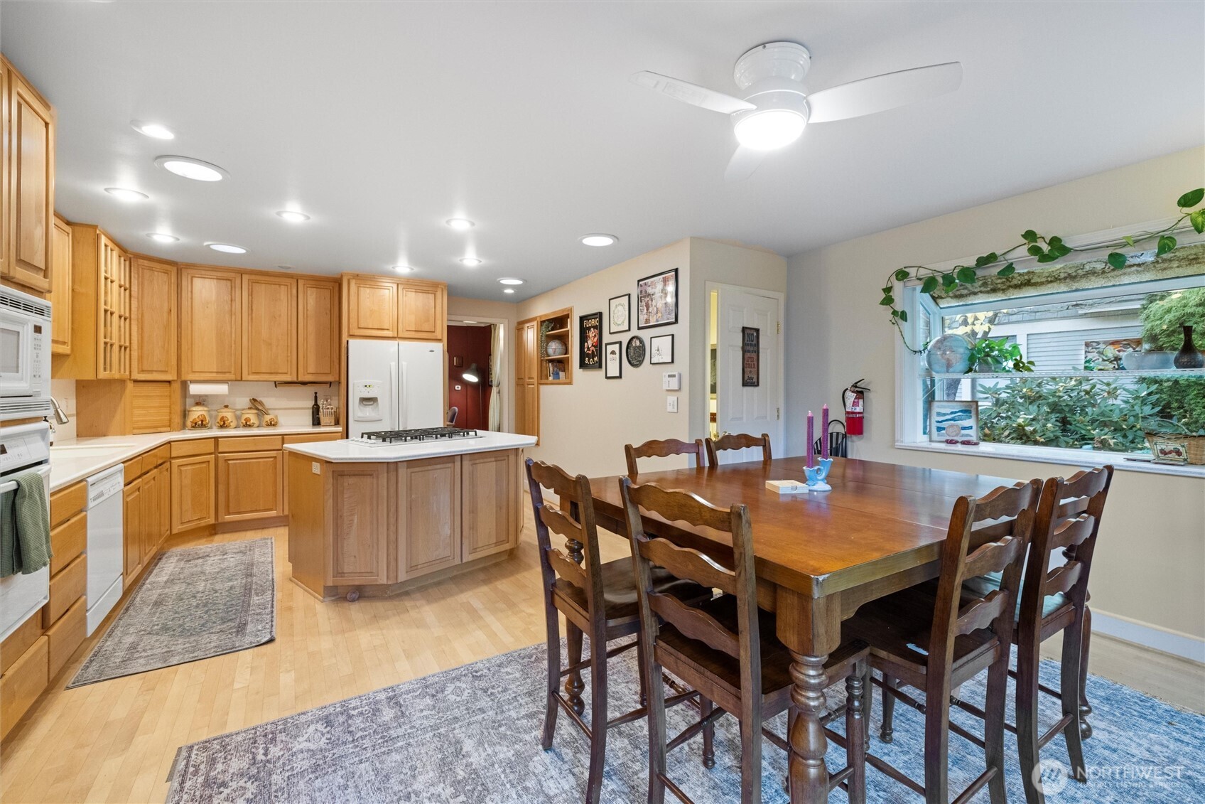 705 Pearson Street Walla Walla, WA 99362 - Photo 13 of 39 a kitchen with a dining table chairs and stove