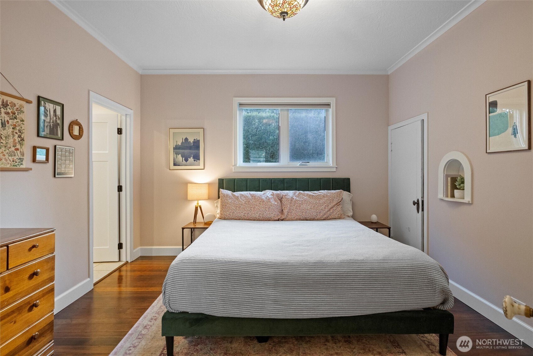 705 Pearson Street Walla Walla, WA 99362 - Photo 15 of 39 a bedroom with a bed and wooden floor