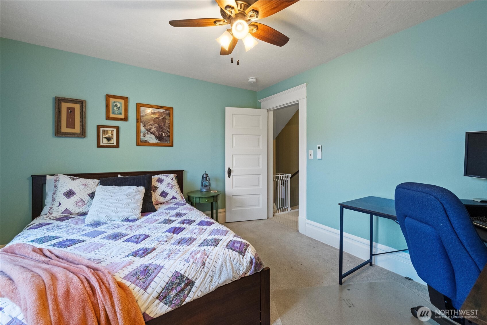 705 Pearson Street Walla Walla, WA 99362 - Photo 24 of 39 a bedroom with a bed and a chandelier