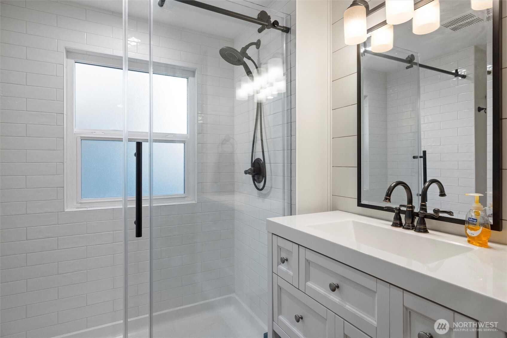 705 Pearson Street Walla Walla, WA 99362 - Photo 26 of 39 a bathroom with a double vanity sink mirror and shower
