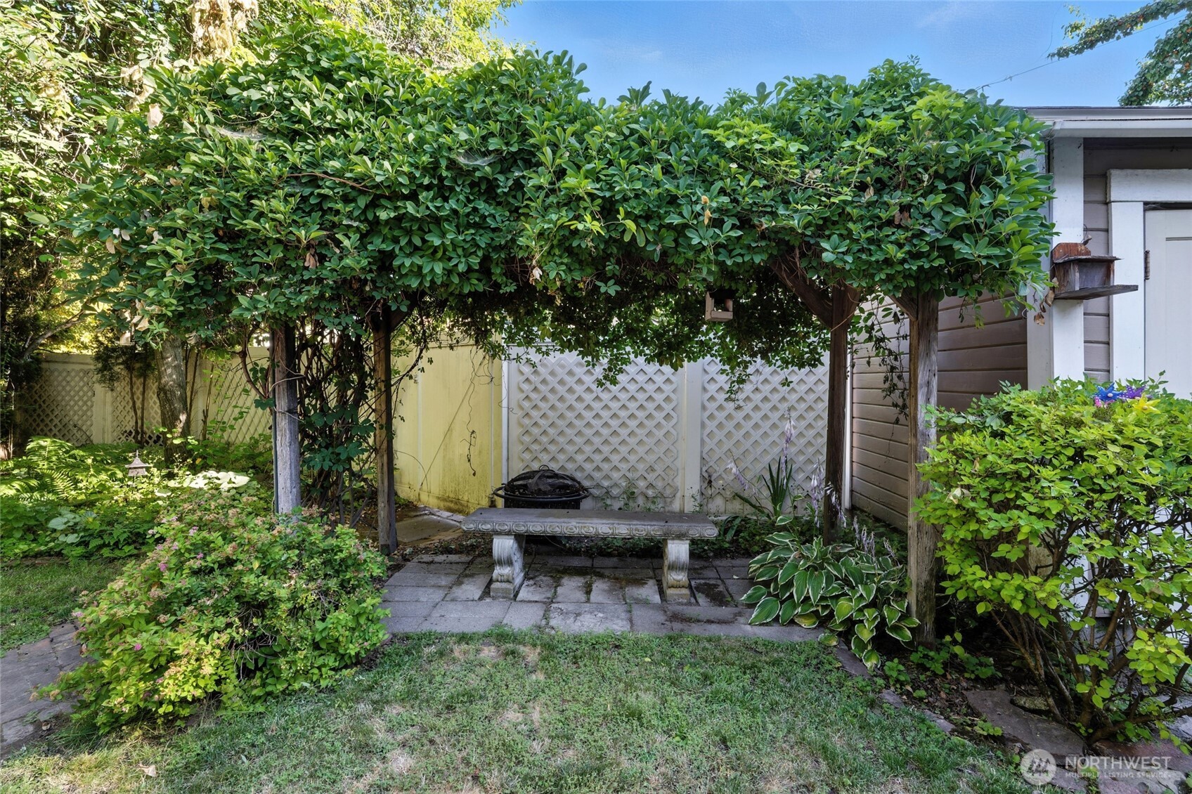 705 Pearson Street Walla Walla, WA 99362 - Photo 35 of 39 a view of a backyard with plants and a tree