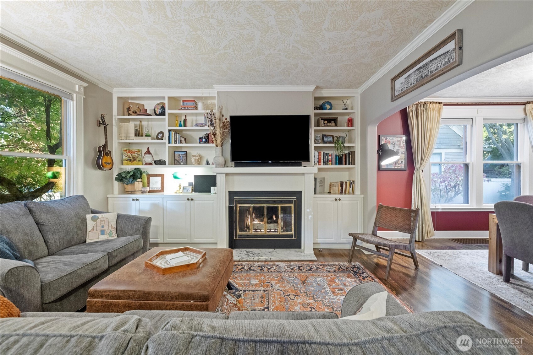 705 Pearson Street Walla Walla, WA 99362 - Photo 5 of 39 a living room with furniture a flat screen tv and a fireplace