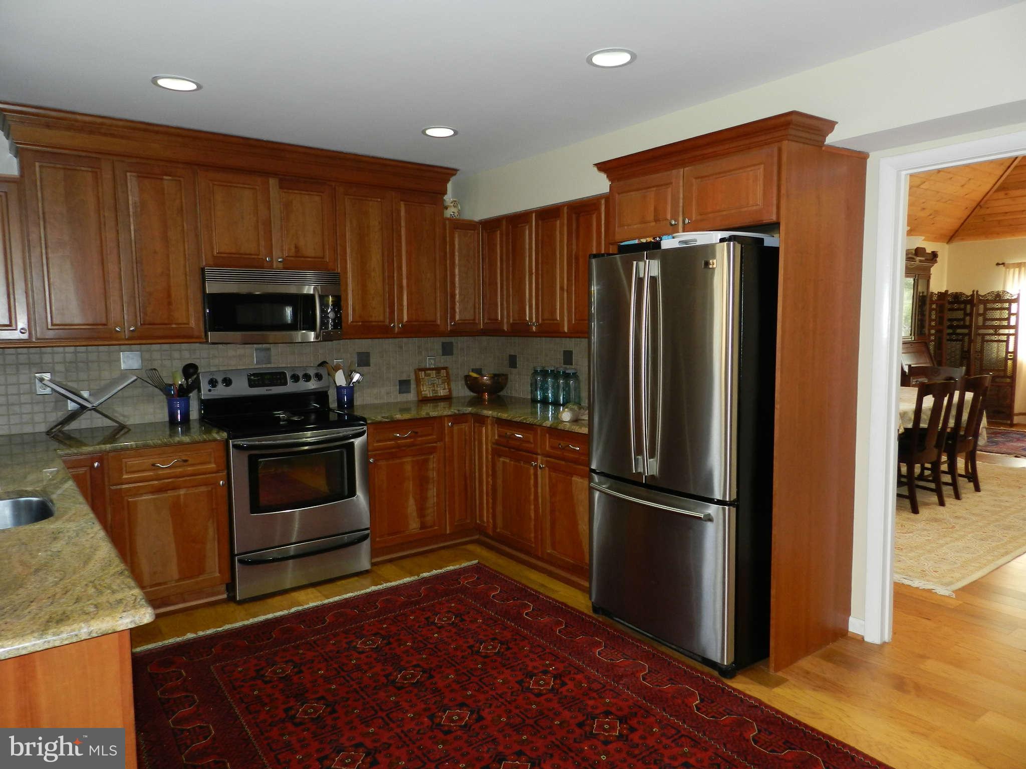 11308 Harborside Cluster Reston, VA 20191 - Photo 7 of 29 REMODELED KITCHEN WITH GRANITE