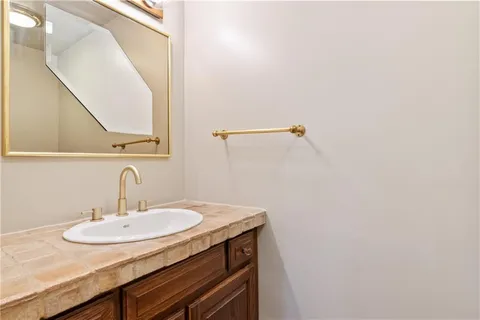a living room with a fireplace and a large window