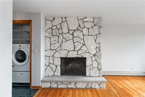 a bedroom with a bed and a fireplace