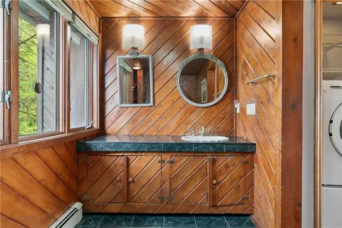 a bathroom with a bathtub and shower