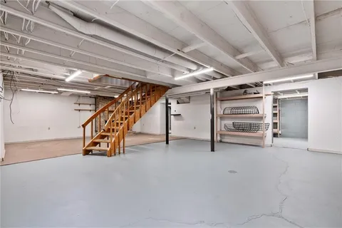 a view of an empty room with stairs