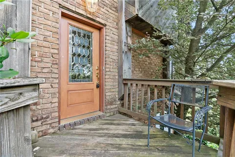 a view of a wooden bench on the deck