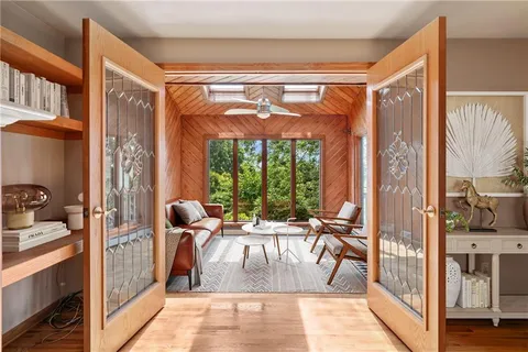a view of living room with furniture and floor to ceiling window
