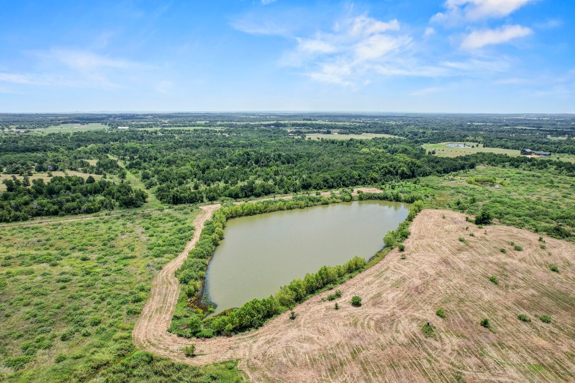 3935 County Road 463 Elgin, TX 78621 - Photo 5 of 23 Aerial view of a large body of water and a forest