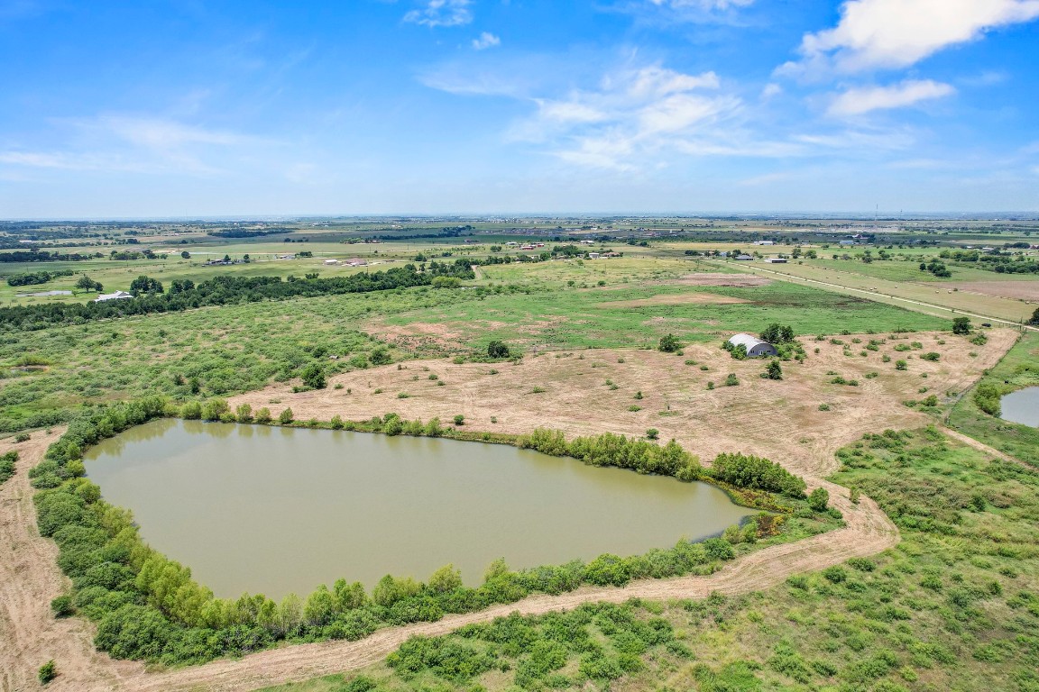 3935 County Road 463 Elgin, TX 78621 - Photo 6 of 23 Aerial view of sparsely populated area featuring a large body of water