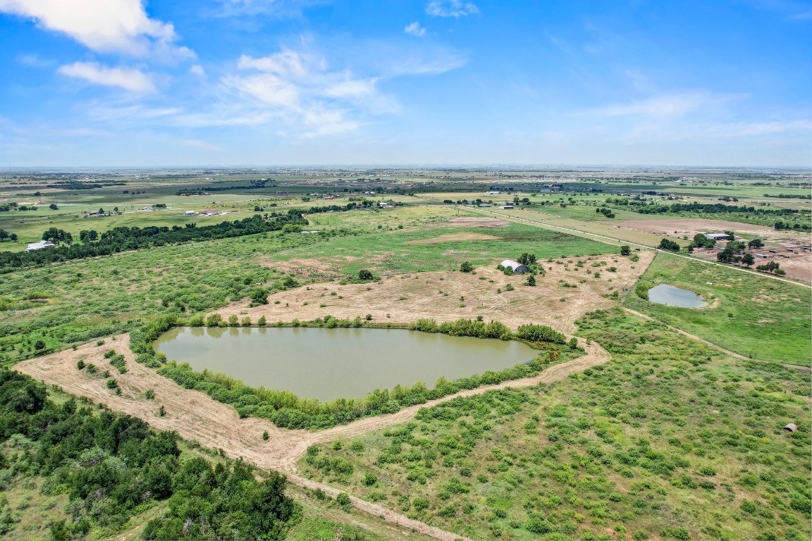 3935 County Road 463 Elgin, TX 78621 - Photo 7 of 23 Overview of rural landscape with a nearby body of water